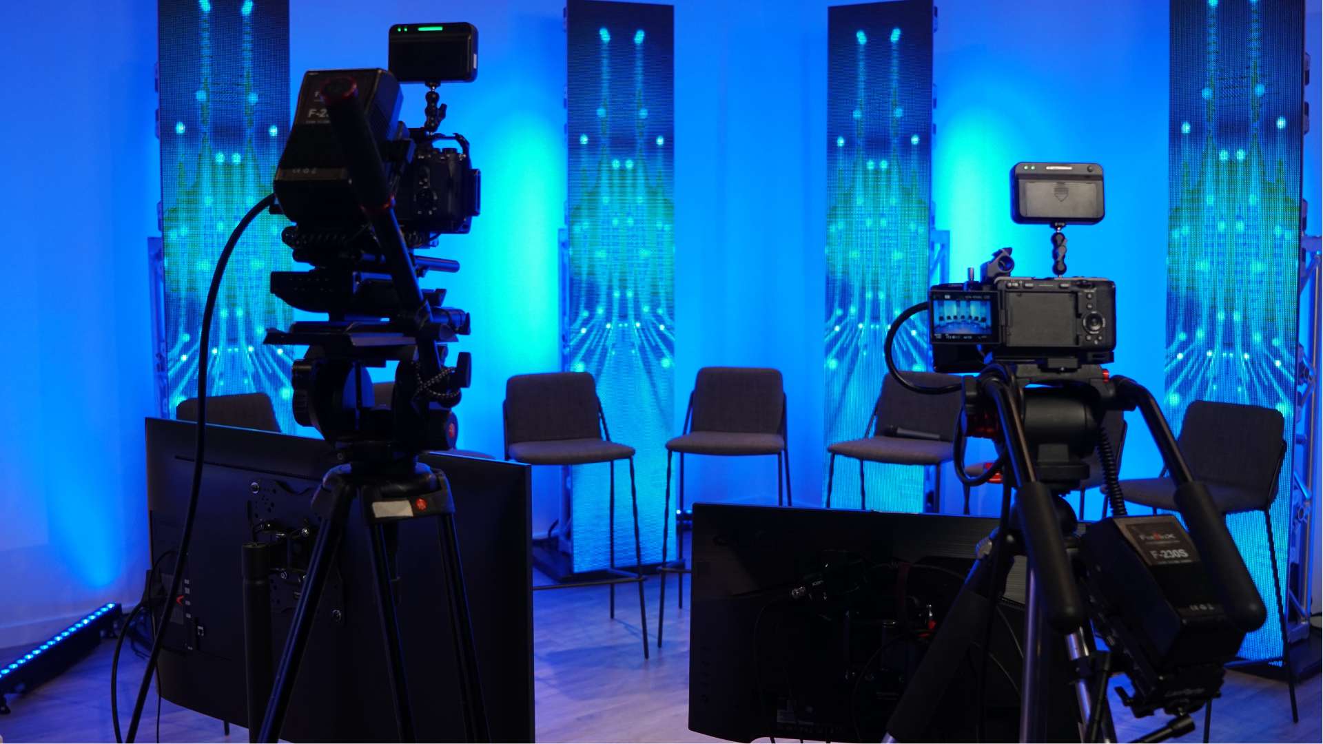 Scene with eight chairs for live panel discussion