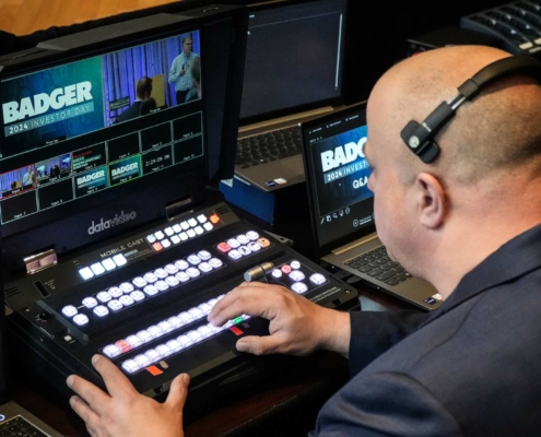 Image of producer Leslie Fultz operating the switcher at Badger's Investor Day event production.