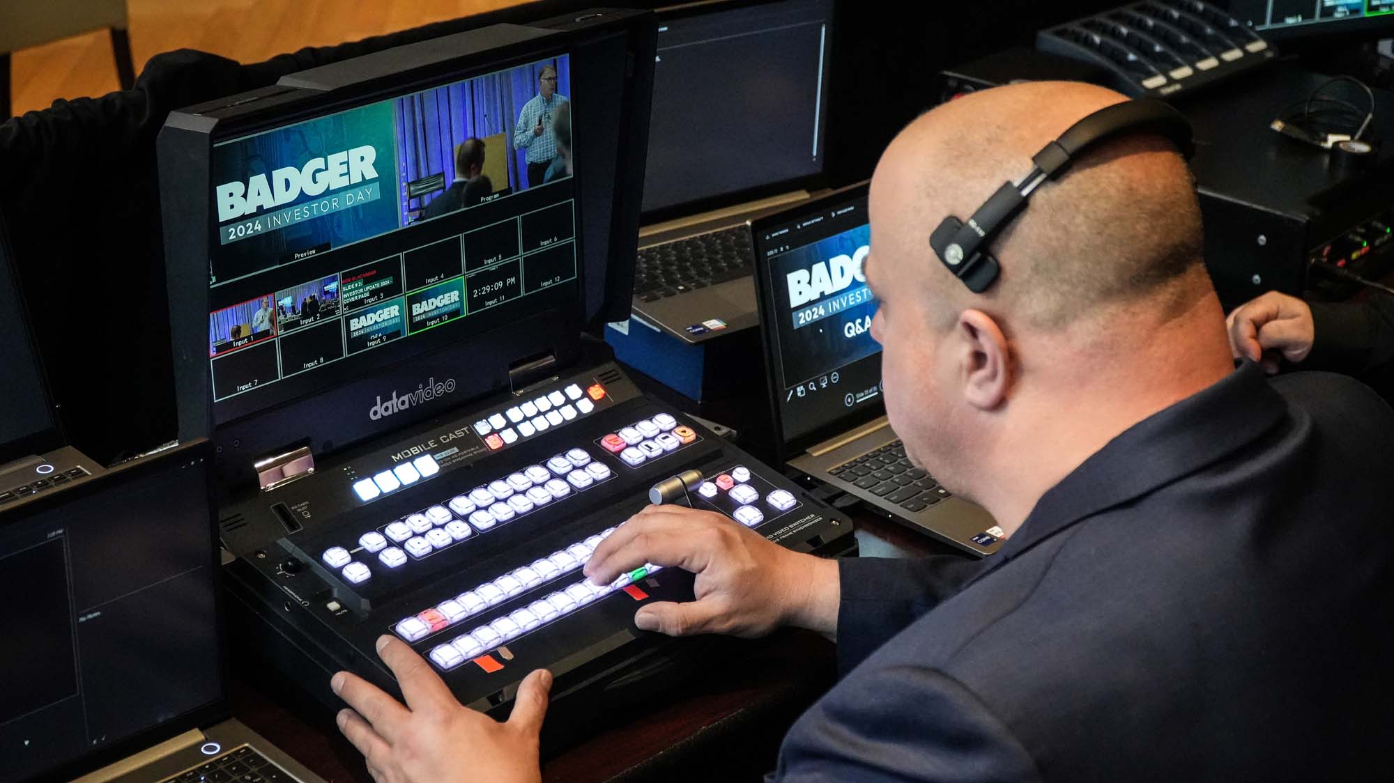 Image of producer Leslie Fultz operating the switcher at Badger's Investor Day event production.
