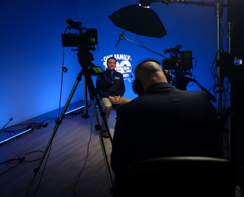 BTS Image of Tim Prince being interviewed as part of a studio video production for Home City Ice.